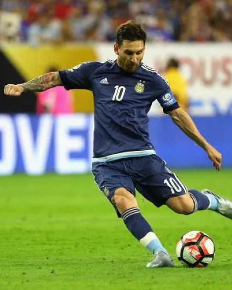 Lionel Messi striking a free kick against the USA in Houston