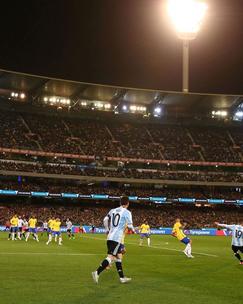 Lionel Messi on the pitch at the Melbourne Cricket Ground against Brazil